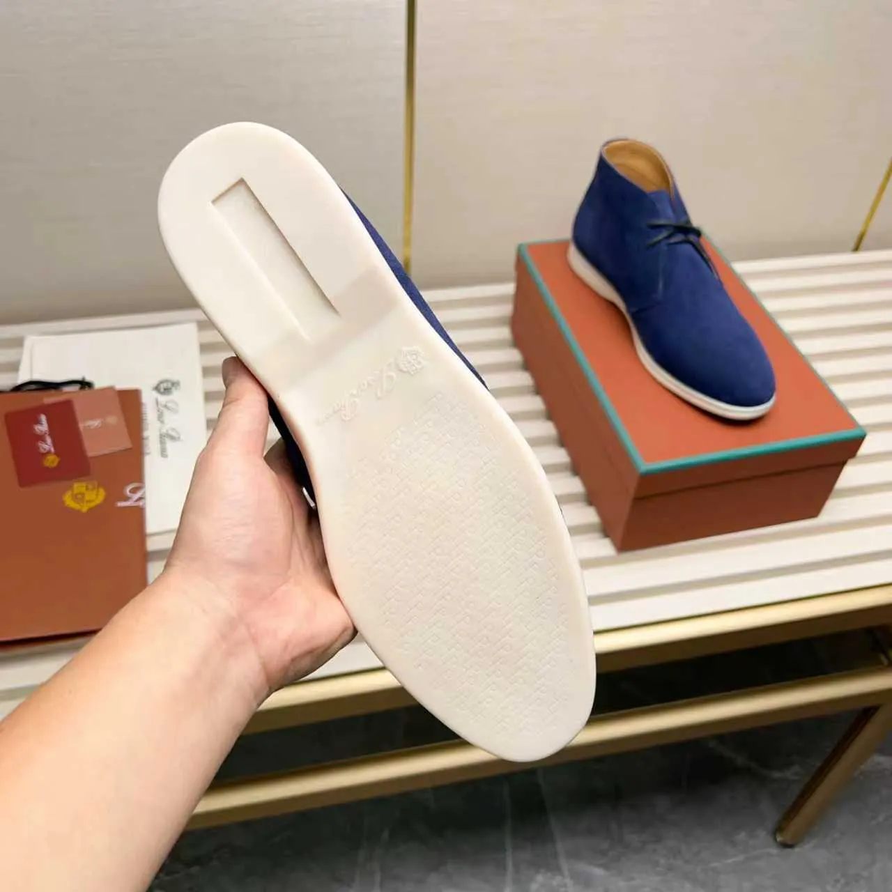 Men's Shoes 💰420 Loro Piana reimagines the desert boot—a modern, comfortable interpretation of a classic 1940s style. Crafted from suede calfskin, it exudes elegance. The tight texture of suede calfskin is not only durable but also looks casual and sophisticated. Add a timeless piece to your shoe collection, harmoniously blending comfort, style and Loro Piana's heritage of craftsmanship. Acetate satin detail on the inside White sole with LP lettering for added traction Space for a personalized signature on the heel Tonal suede trim Upper: 100% cow split suede Sole: 100% Rubber lining: Cow leather